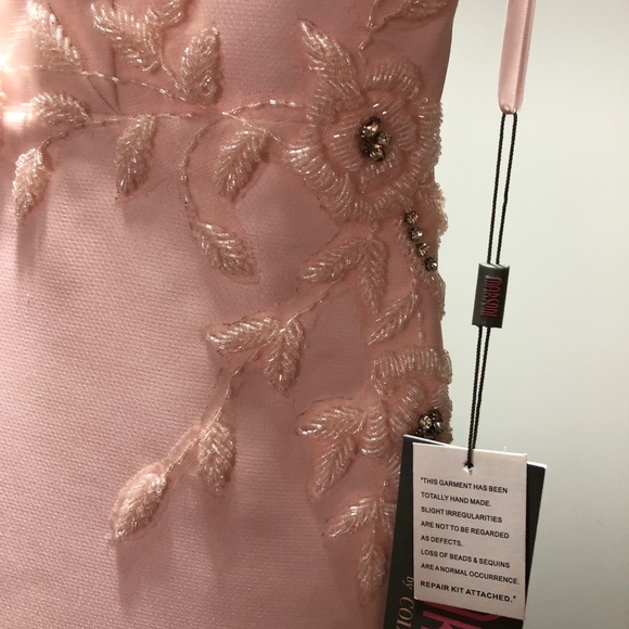 BRING OUT THE ROMANTICSPIRIT WITH THIS MARSONI BY COLORS GOWN. Size 14
